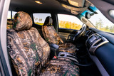 Luxury Line Realtree Camo Seat Covers full set shown on seats with matching headrests and full-coverage camo design.