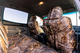 Luxury Line Realtree Camo Seat Covers side view seats with full camo coverage.