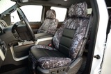 Luxury Line Moon Shine Seat Covers on front truck seats, featuring branch camo sides and black textured center inserts.