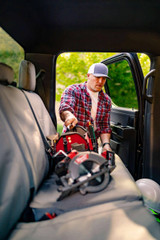 Man getting into a truck equipped with durable Tan Cordura seat covers, showcasing the custom fit and rugged design for outdoor lifestyles.
