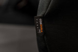 Extreme close-up of the official Cordura Fabric brand label on a black heavy-duty custom seat cover.