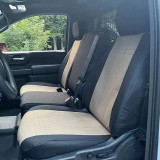 Custom-fit Waterproof CORDURA® seat covers in a black and tan two-tone design, installed on the front seats of a work truck.