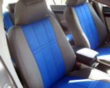 NeoSupreme seat covers on front buckets, charcoal bolsters with royal blue quilted centers and matching console cover.