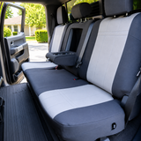 NeoSupreme seat covers on truck 60/40 rear bench, charcoal bolsters with light gray grid-stitched inserts and armrest down.