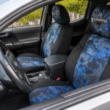 Custom-fit Kryptek® Camo seat covers in a striking blue "Pontus" pattern installed on front bucket seats, offering a bold tactical look for vehicle interiors.