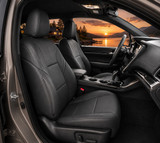 Genuine Leather Seat Covers in black, premium custom-fit front bucket seats for a sleek, high-end vehicle interior.