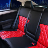 Luxury Line Carbon Fiber Seat Covers (Flame Red) on a rear bench seat, featuring red diamond-stitched inserts and black carbon fiber bolsters.
