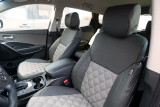 Luxury Line Diamond Stitch Seat Covers in a vehicle, two-tone black leatherette bolsters with light gray diamond-stitched inserts.