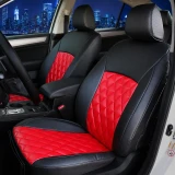 Luxury Line Diamond Stitch Seat Covers (Flame Red) in a car, featuring red diamond-stitched inserts and black carbon-fiber-textured bolsters.