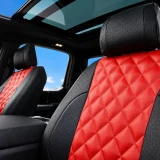Luxury Line Diamond Stitch Seat Covers (Flame Red) installed in a truck, featuring red diamond-stitched inserts with black ostrich-textured bolsters.
