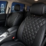 Luxury Line Diamond Stitch Seat Covers installed in a vehicle, featuring black leatherette with a premium quilted diamond pattern and ostrich-style texture.