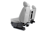Rear view of Luxury Line Diamond Stitch Seat Covers in light gray, showing built-in storage pockets and custom console/cupholder openings.