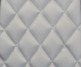 Close-up of Luxury Line Diamond Stitch Seat Covers in light gray, showing the detailed quilted diamond stitching and leatherette texture.