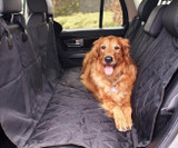 Golden retriever on Atomic Black Universal Pet Seat Cover, providing comfortable and durable rear seat protection.