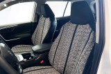 Luxury Line Saddle Blanket seat covers on front buckets, salt-and-pepper weave with twin black stripes and black bolsters.