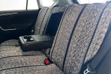Luxury Line Saddle Blanket seat covers on rear bench, heathered gray weave with black stripes and armrest cupholders down.