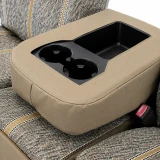 Close-up of Luxury Line Saddle Blanket Seat Covers console cover with precise openings for cupholders and storage.