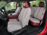 Interior view of Luxury Line Saddle Blanket Seat Covers on front and rear seats, woven fabric with dark red trim.