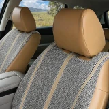 Close-up of Luxury Line Saddle Blanket Seat Covers showing woven fabric texture and tan leatherette trim.