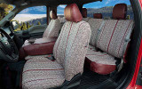 Interior view of Luxury Line Saddle Blanket Seat Covers on front and rear seats, woven fabric with dark red trim.