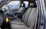 Luxury Line Saddle Blanket Seat Covers installed in a truck interior, featuring woven inserts with black leatherette trim.