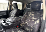 Black MultiCam Seat Covers installed on front bucket seats and center console in a truck, offering a rugged tactical custom-fit look.