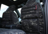 Black MultiCam Seat Covers featuring a rear Tactical MOLLE System with gear straps and dual storage pockets for organized storage.
