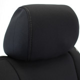 Close-up of the headrest on a Semi-Custom Pro Mesh Seat Cover, featuring durable black fabric and precision contrast stitching.