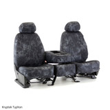 Front bucket seats and center console with Kryptek Typhon camo seat covers, featuring a dark tactical scale pattern.