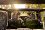 Lifestyle view from inside a Jeep with Kryptek Typhon camo seat covers, perfect for open-top off-road adventures.