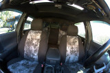 Kryptek Typhon waterproof camo on front and rear seats, dark grey bolsters, monochrome geometric center inserts.