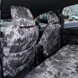 Rear view of front seats equipped with Kryptek® Waterproof Camo seat covers in the "Raid" pattern, featuring integrated storage pockets.