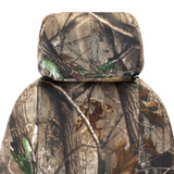 Close-up of the headrest and upper seatback of Realtree Camo NeoSupreme Seat Covers, featuring a high-definition forest camo pattern.