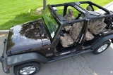 Luxury Line Kryptek Camo Seat Covers installed in a Jeep, for a rugged custom look.
