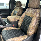 Luxury Line Kryptek camo seat covers on 40/20/40 seats with console, Highlander sides and black quilted leather inserts.