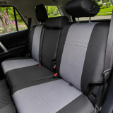 Rear bench seat of an SUV protected by durable grey and black CORDURA® seat covers, demonstrating a perfect fit that maintains all seat functionalities.