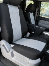 Driver's seat equipped with a grey and black CORDURA® 1000 Denier seat cover, highlighting the rugged fabric texture and precise, custom-fit design.