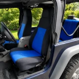 High-back front bucket seats in a Jeep Wrangler outfitted with vibrant blue and black neoprene seat covers, offering a rugged, water-resistant solution for off-road adventures.