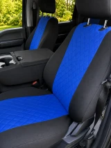 Custom-fit neoprene seat covers in blue and black, featuring a premium diamond-quilted center pattern and a matching center console cover for a modern, sporty look.