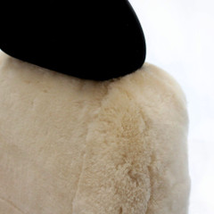 Close-up of Tailor-made Sheepskin Seat Covers showing plush natural sheepskin texture and fit around the headrest.