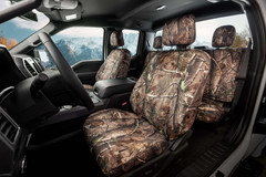Realtree Waterproof Camo Seat Covers installed on front seats, waterproof camo for durable everyday protection.