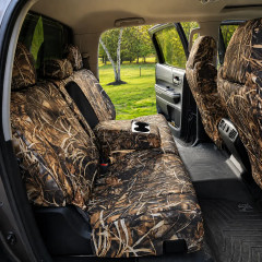 Realtree Waterproof Camo seat covers on 60/40 rear bench with armrest down, matching camo on three headrests and front backs.