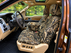 Realtree Waterproof Camo seat covers on Ford 40/20/40 bench, wetlands camo on headrests, cushions, and center jump seat.