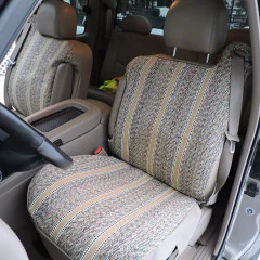 Driver's seat showcasing a tan and brown striped saddle blanket seat cover, highlighting the heavy-duty, textured material.