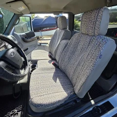 Saddle Blanket seat covers on Ford truck front bench, grey woven weave with dark stripes and solid grey bolsters.