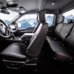 Black Pro-Tect Vinyl Seat Covers installed in a vehicle, heavy-duty vinyl with a tailored fit and full coverage.