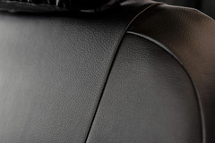 Close-up of Pro-Tect Vinyl Seat Covers showing the heavy-duty water-resistant vinyl texture and durable stitching.