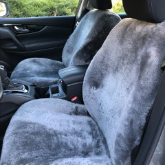 Semi-Custom Sheepskin Seat Covers installed on front seats in a vehicle, plush gray sheepskin with a snug fit.