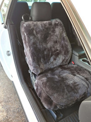 Semi-Custom Sheepskin Seat Covers on a single front seat in charcoal gray, plush sheepskin cushion and backrest coverage.