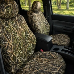 Mossy Oak Waterproof Camo seat covers on front buckets, full Shadow Grass Blades camo on headrests, backrests, and cushions.